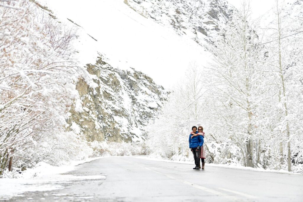 Couple enjoying a snowy winter mountain landscape