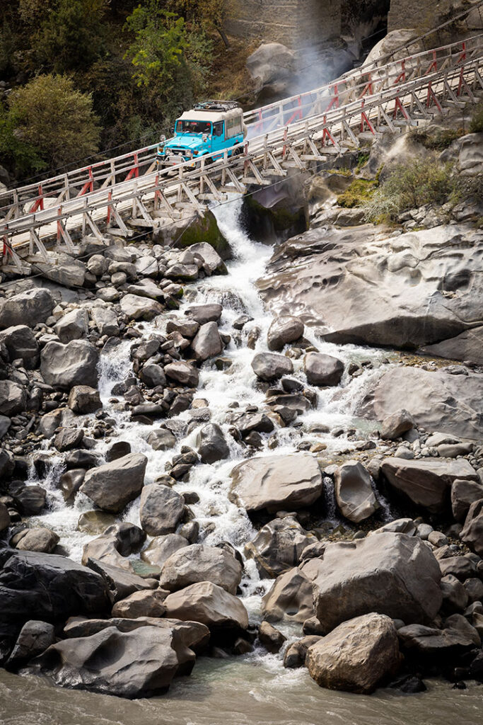 Rocky stream beneath Baltistan mountain slopes