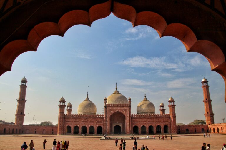 Badshahi Mosque in Lahore viewed through a Mughal arch