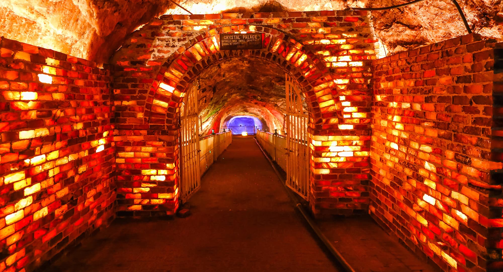 Illuminated salt-brick corridor inside Khewra Salt Mine