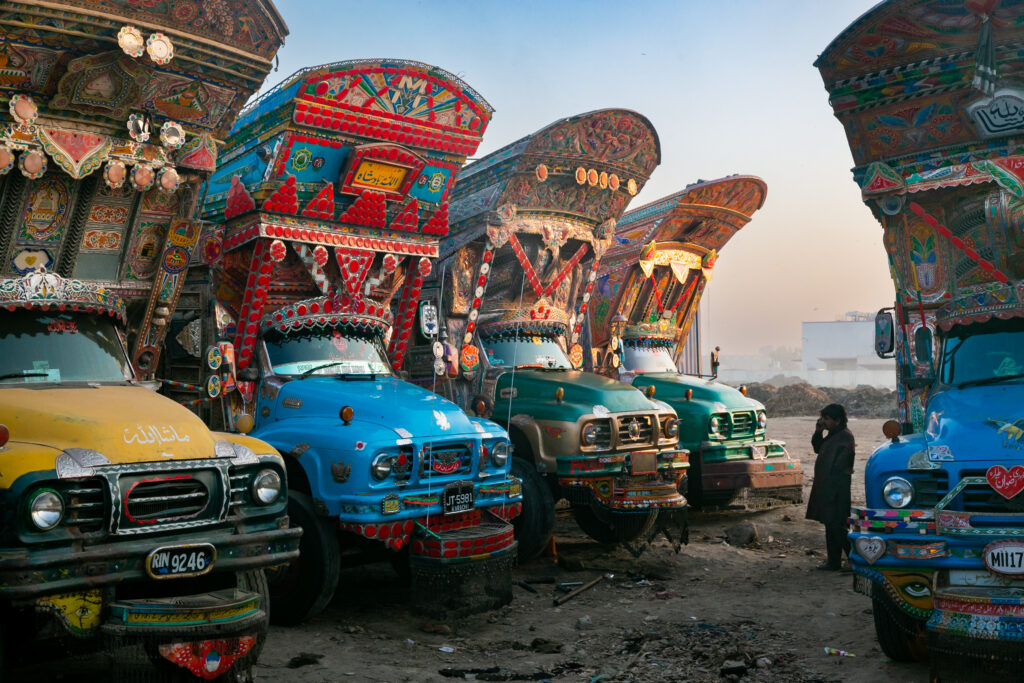 Decorated trucks displaying the vivid painting and craftsmanship of Pakistan’s truck-art tradition.