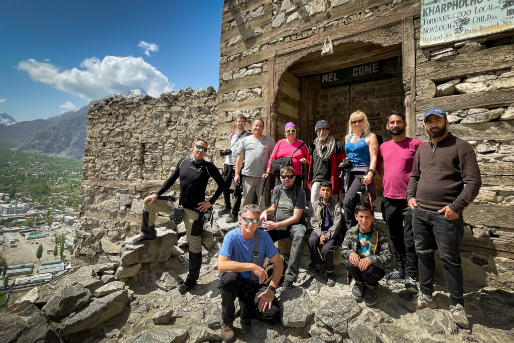 Guests outside the stone entrance of Kharpocho Fort above Skardu.