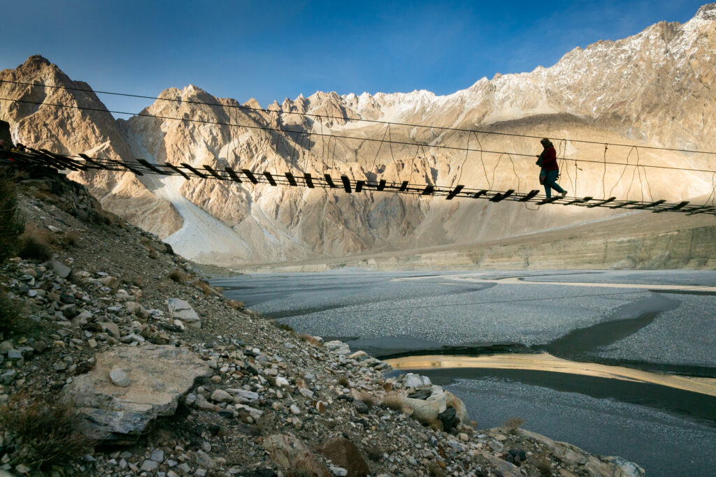 A walker crossing the suspension bridge at Zarabad in Upper Hunza.