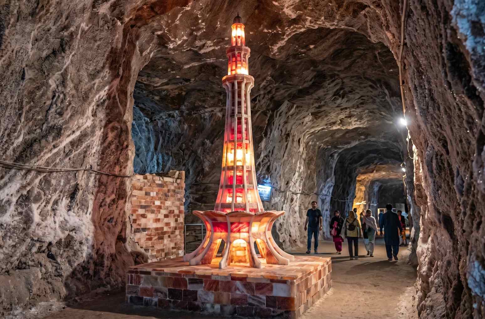 Salt sculptures and illuminated Minar-e-Pakistan replica built from pink and white salt bricks inside Khewra Salt Mine Punjab Pakistan