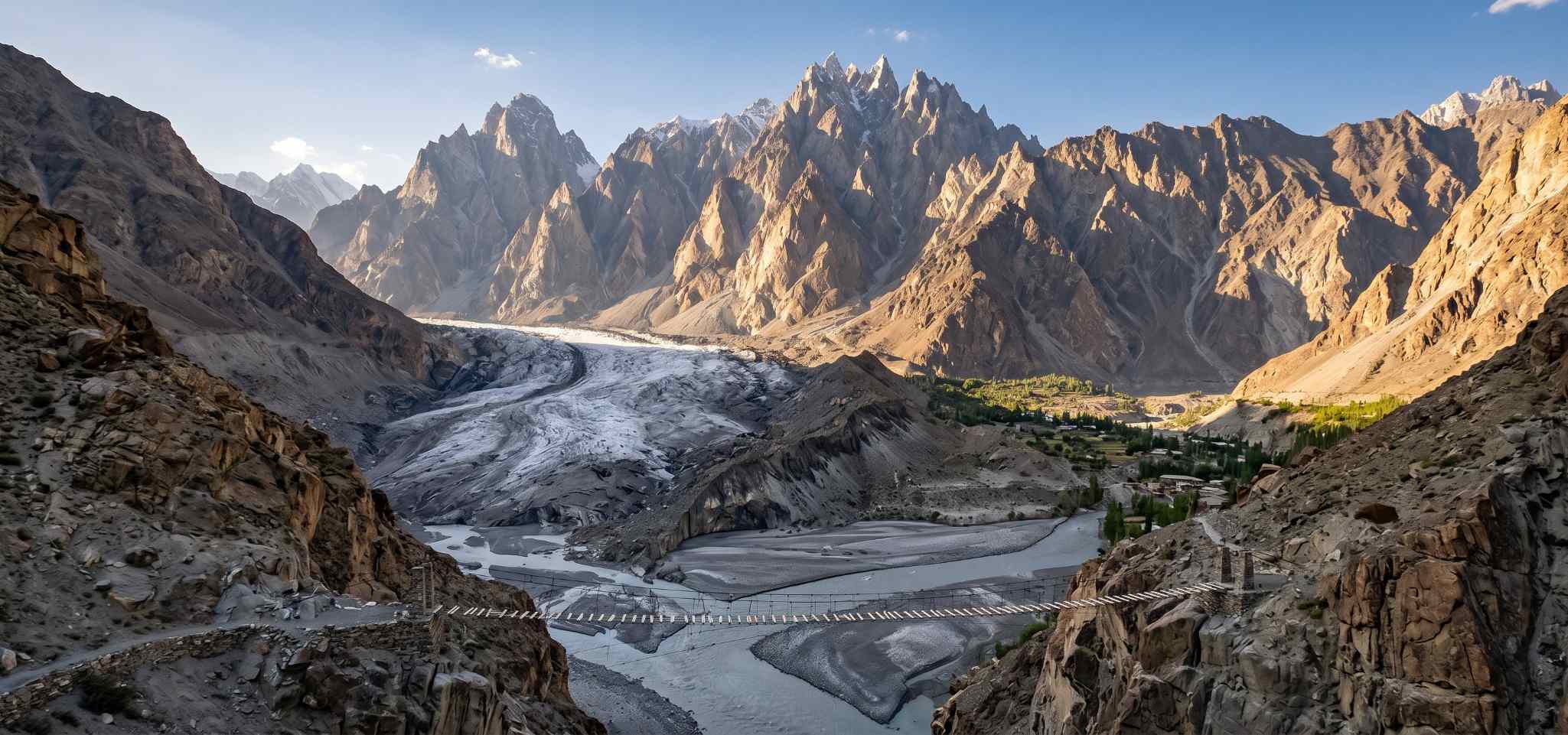 The Passu Glacier and Passu Cones in Upper Hunza Pakistan with the sharp cathedral rock spires rising above the glacier snout