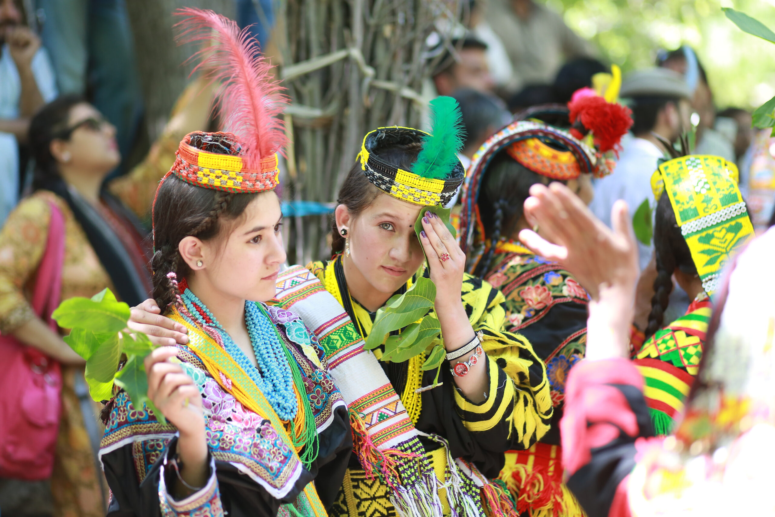 Kalash women in colourful traditional dress and headdresses