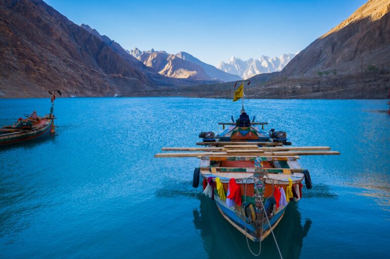 A boat on the turquoise water of Attabad Lake, Hunza.